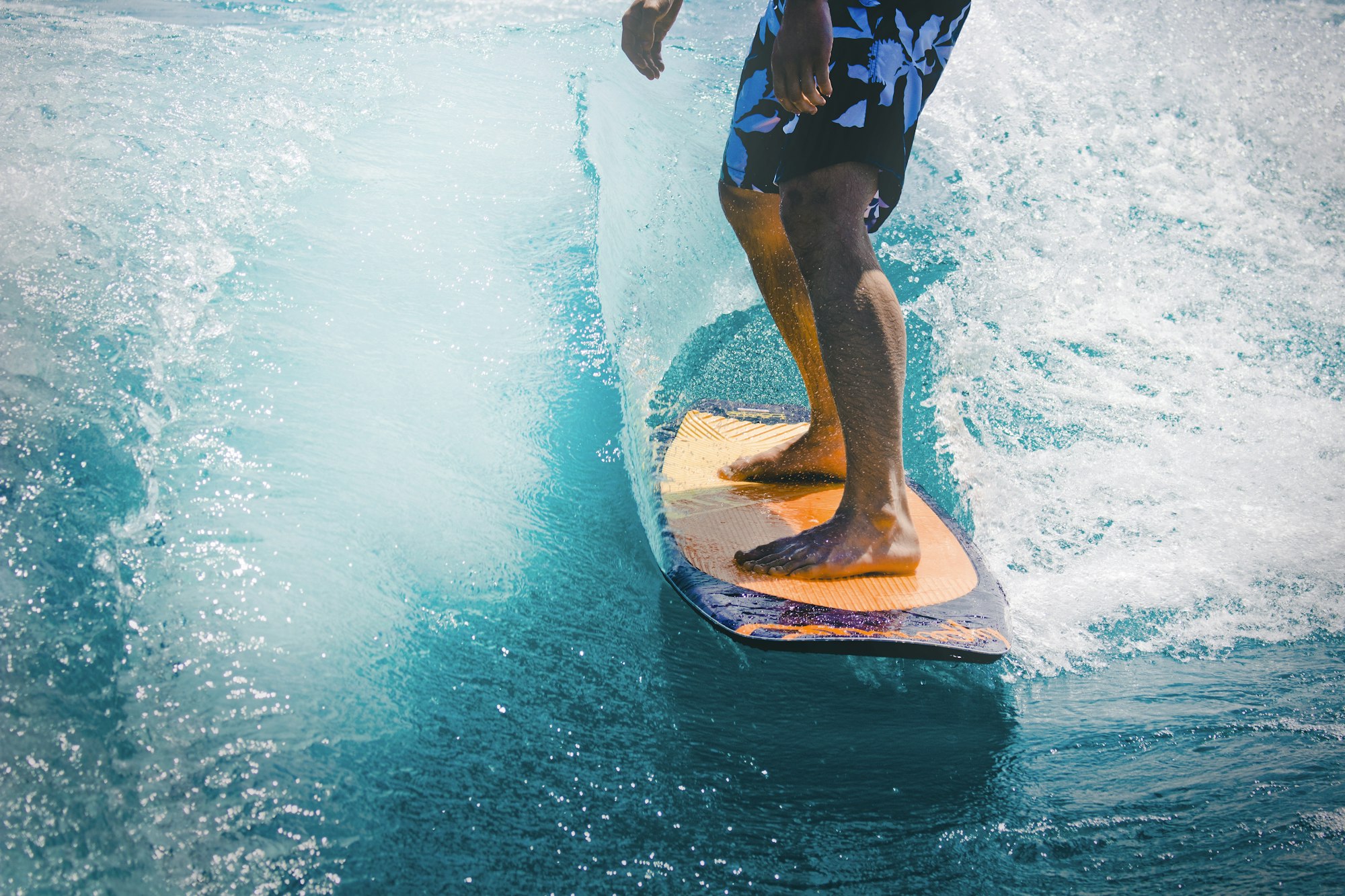 A surfer riding a point break in Sri Lanka